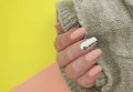 female hand beautiful manicure sweater, knitted acrylic Royalty Free Stock Photo