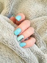 Female hand beautiful manicure sweater cold Royalty Free Stock Photo
