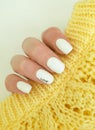 Female hand beautiful manicure sweater cold  creative Royalty Free Stock Photo