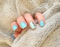 Female hand beautiful manicure sweater cold polish Royalty Free Stock Photo