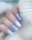 Female hand beautiful manicure sweater  cozy  elegant glamour  winter Royalty Free Stock Photo