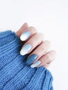 Female hand beautiful manicure, sweater, winter style Royalty Free Stock Photo