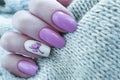 Female hand beautiful nail manicure elegant fashion sweater lifestyle clothing floral Royalty Free Stock Photo