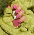 Female hand beautiful pink fashionable manicure sweater creative