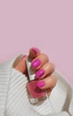 Female hand beautiful pink manicure sweater creative