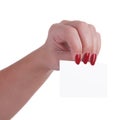 Female hand with beautiful red nails holding a business card Royalty Free Stock Photo