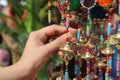 Female hand choosing decorative windchime