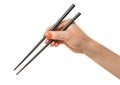 Female hand with chopsticks Royalty Free Stock Photo