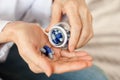 Female hand close up holding a medicine, elderly woman hands with pill on spilling pills out of bottle Royalty Free Stock Photo