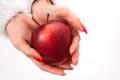Female hand in close up holding red apple isolated on white background Royalty Free Stock Photo