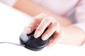 Female hand on computer mouse Royalty Free Stock Photo