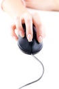 Female hand on computer mouse Royalty Free Stock Photo