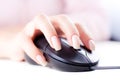 Female hand on computer mouse Royalty Free Stock Photo