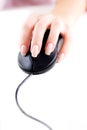 Female hand on computer mouse Royalty Free Stock Photo