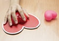 Female hand with computer mouse on table.valentine day Royalty Free Stock Photo