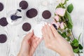 Female hand cream cotton pad cookie flowers Royalty Free Stock Photo