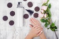 Female hand cream cotton pad cookie flowers Royalty Free Stock Photo