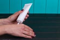 Female hand cream squeeze out of tube Royalty Free Stock Photo