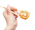 Chopsticks hold california ebi roll isolated