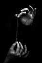 Female hand elegantly holding an ink pen with a metal tip close-up on a black background. classic fountain pen isolated macro Royalty Free Stock Photo