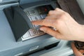 Female hand entering a secure PIN code at a cash point or ATM up close and in detail Royalty Free Stock Photo