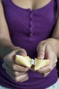 Female hand and fortune cookie Royalty Free Stock Photo