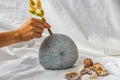 Female hand with a gentle holding a bouquet of Dried flowers on Handmade Ceramic Vase Royalty Free Stock Photo