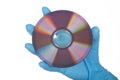 Female Hand in glove with dvd Royalty Free Stock Photo