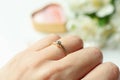 Female hand with golden ring with diamond, close up Royalty Free Stock Photo