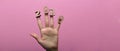 Female hand greets 2020 new year on a colored pink background, wooden figures of numbers on female fingers with a date Royalty Free Stock Photo