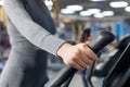 Female hand on the handle of the simulator. workout in the gym Royalty Free Stock Photo