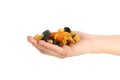 Female hand hold dried fruits, isolated on white background Royalty Free Stock Photo