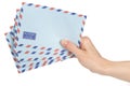Female hand holding air mail envelopes Royalty Free Stock Photo
