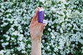 Female hand holding asthma inhaler on attack outdoor Royalty Free Stock Photo