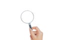 Female hand holding black magnifying glass. Royalty Free Stock Photo