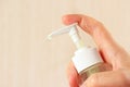 Female hand holding bottle of liquid soap Royalty Free Stock Photo