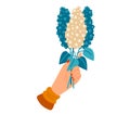 Female hand holding a bouquet of blue and white flowers. Elegant feminine gesture with a stylish flower gift. Caring