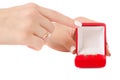 Female hand holding box for jewelry red earring ring