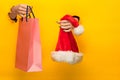 Female hand holding bright shopping bag Royalty Free Stock Photo