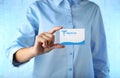 Female hand holding business card of medical service Royalty Free Stock Photo