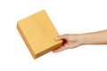 Female hand holding cardboard box isolated on white background Royalty Free Stock Photo