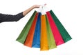 Female hand holding colorful shopping bags Royalty Free Stock Photo