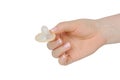 Female hand holding condom Royalty Free Stock Photo