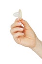 Female hand holding condom Royalty Free Stock Photo