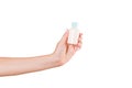 Female hand holding cream bottle of lotion isolated. Girl give tube cosmetic products on white background Royalty Free Stock Photo