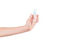 Female hand holding cream bottle of lotion isolated. Girl give tube cosmetic products on white background Royalty Free Stock Photo