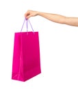 Female hand holding a crimson gift bag