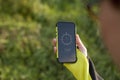 Female hand holding digital compass in the nature Royalty Free Stock Photo