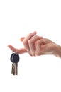Female hand holding door key