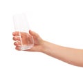 Female hand holding empty clean drinking glass against white Royalty Free Stock Photo